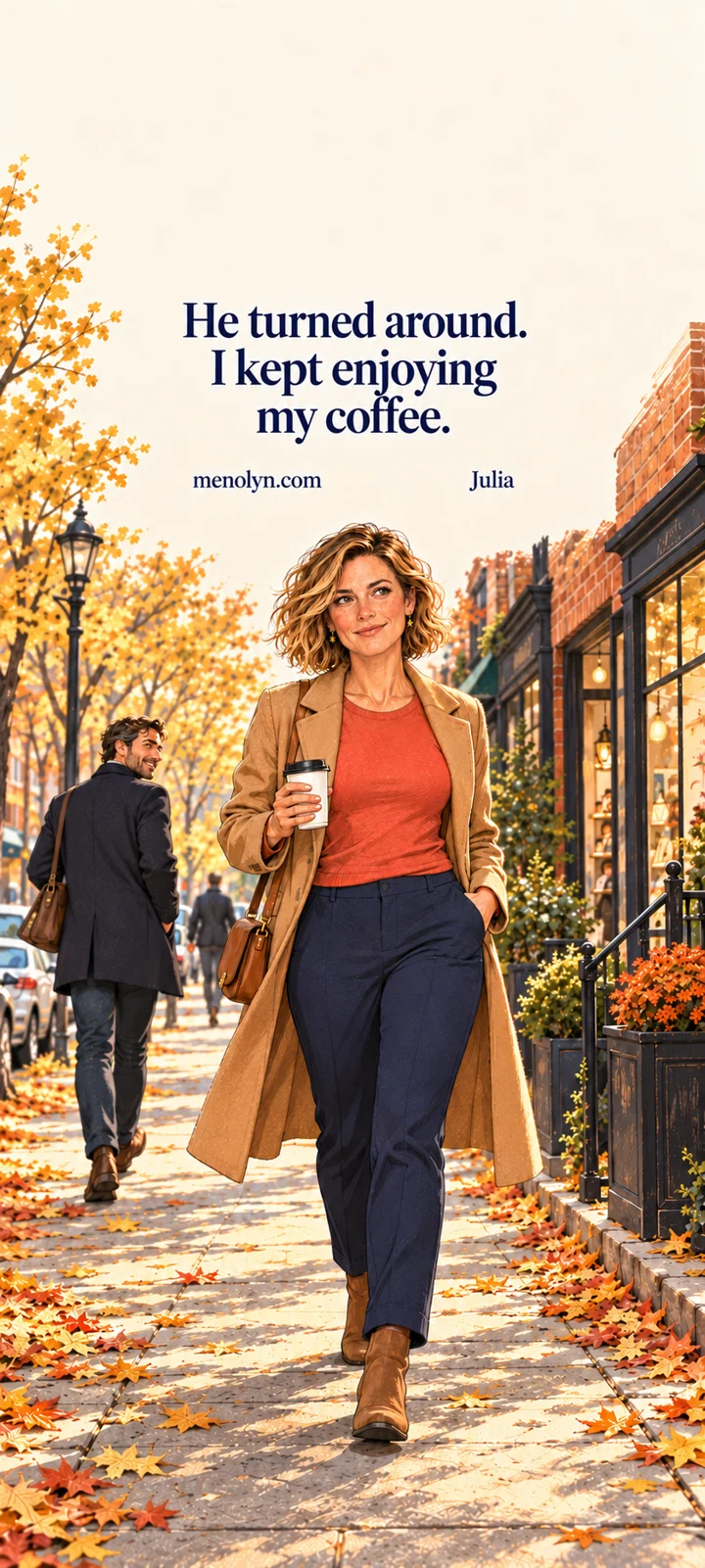 Julia, a blonde woman in a camel coat and coral sweater, walks along a golden autumn New York street with coffee. Her words read: He turned around. I kept enjoying my coffee.